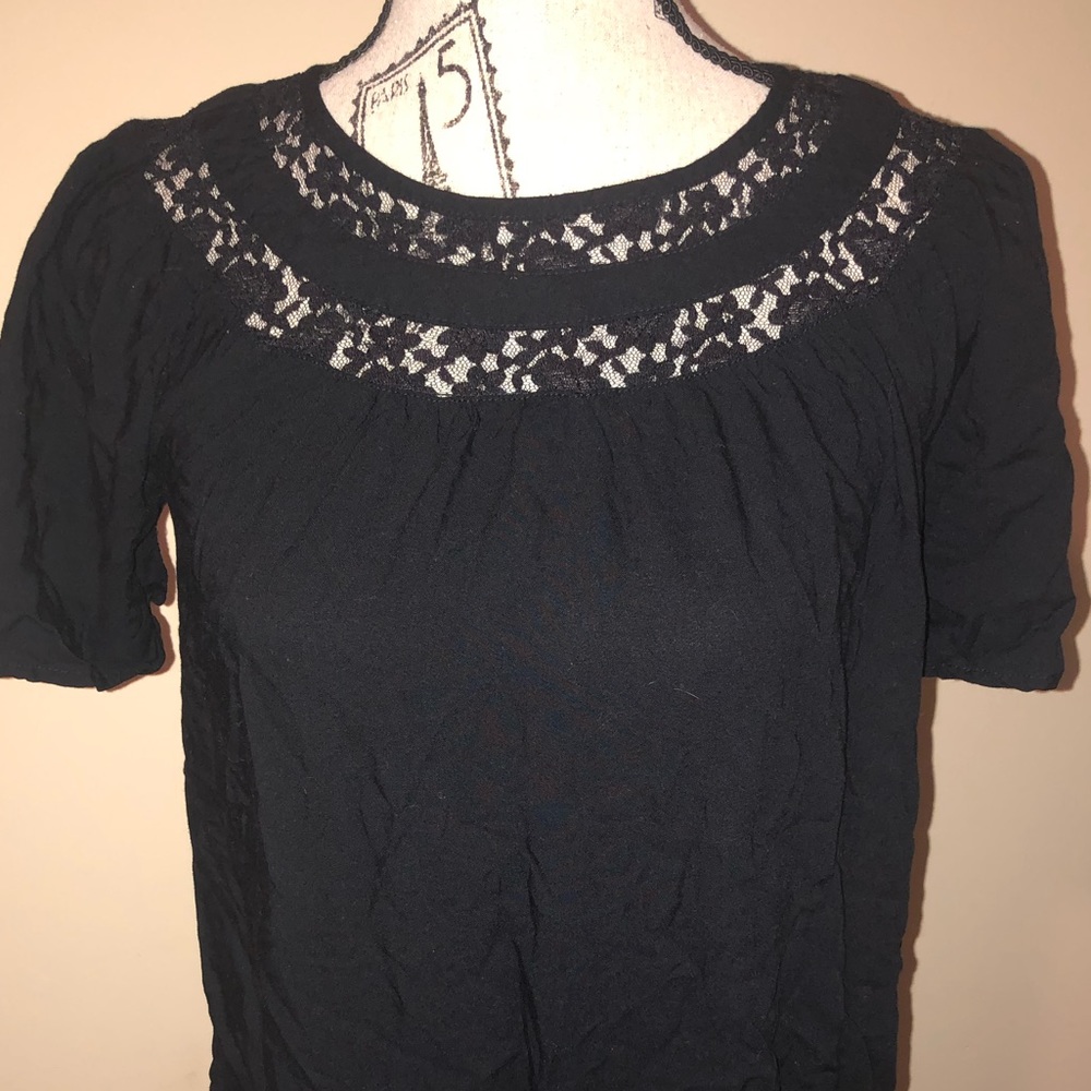 A black dress with lace neckline